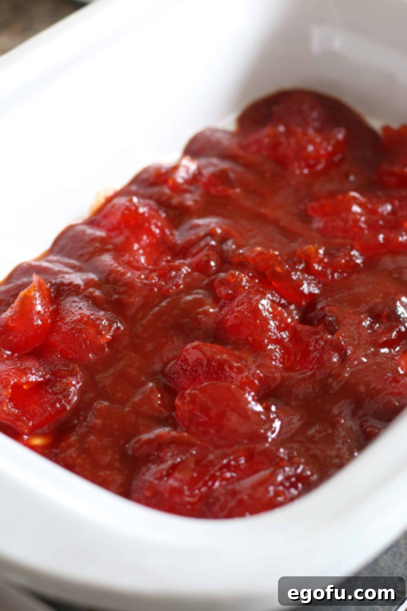 hot pepper jelly and chili sauce combined and poured into the bottom of a slow cooker