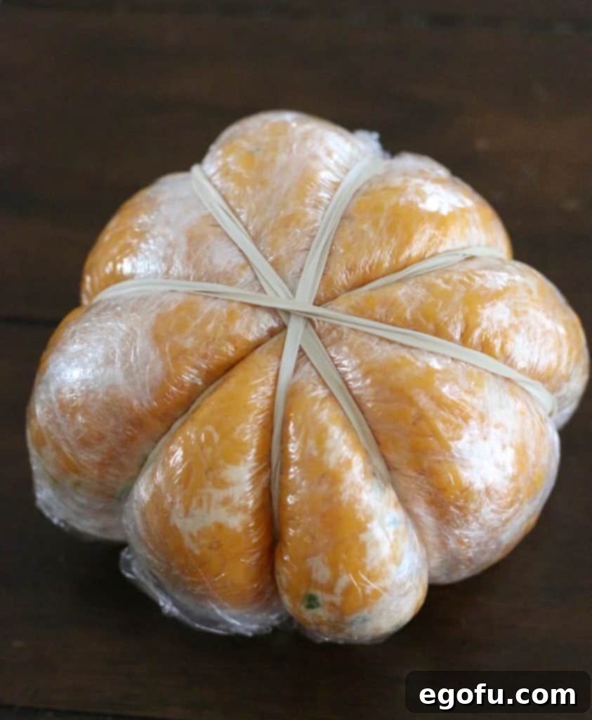The Great Pumpkin Cheese Ball 16 rubber band, plastic wrap cheeseball to form into a pumpkin shape.