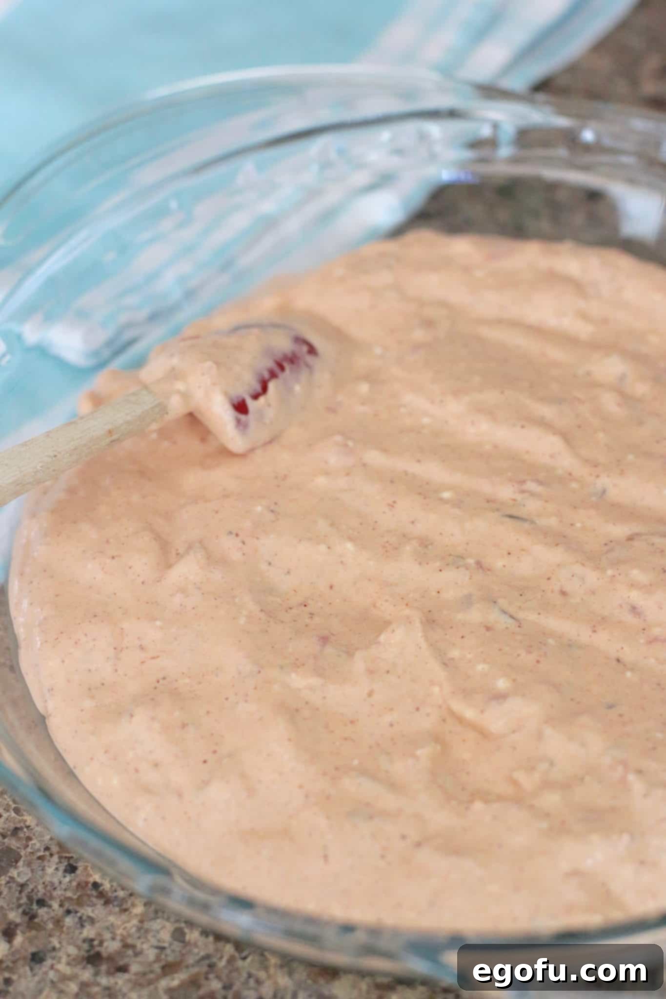 Hot Cheesy Bacon Dip 4 Creamy dip mixture smoothly spread into a round pie pan, ready for toppings.