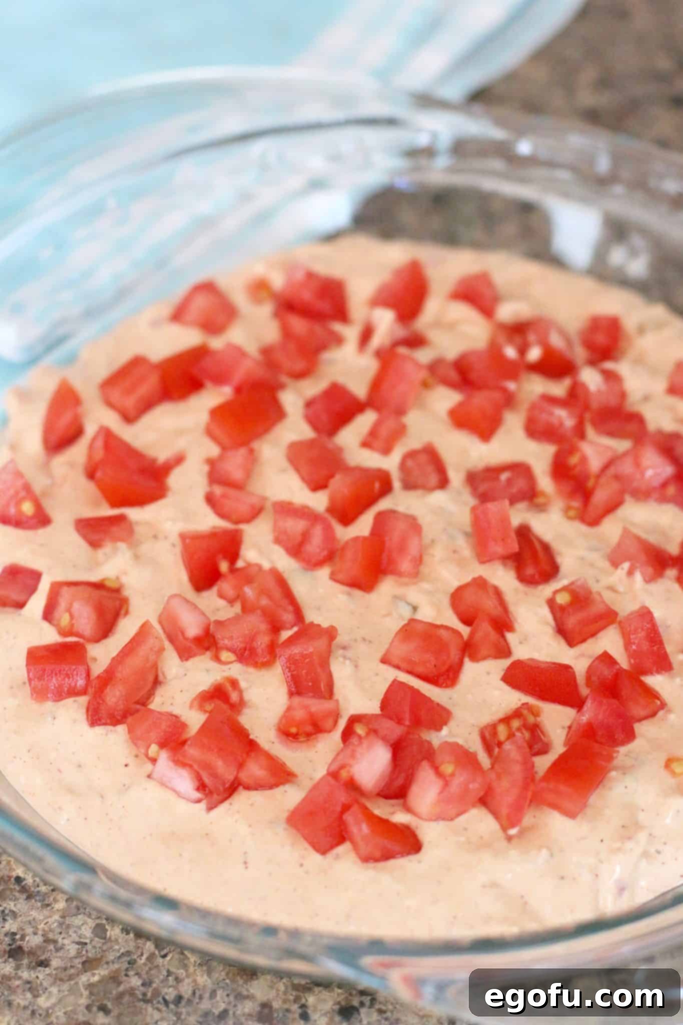 Hot Cheesy Bacon Dip 5 Creamy dip mixture topped with a generous layer of chopped tomatoes.