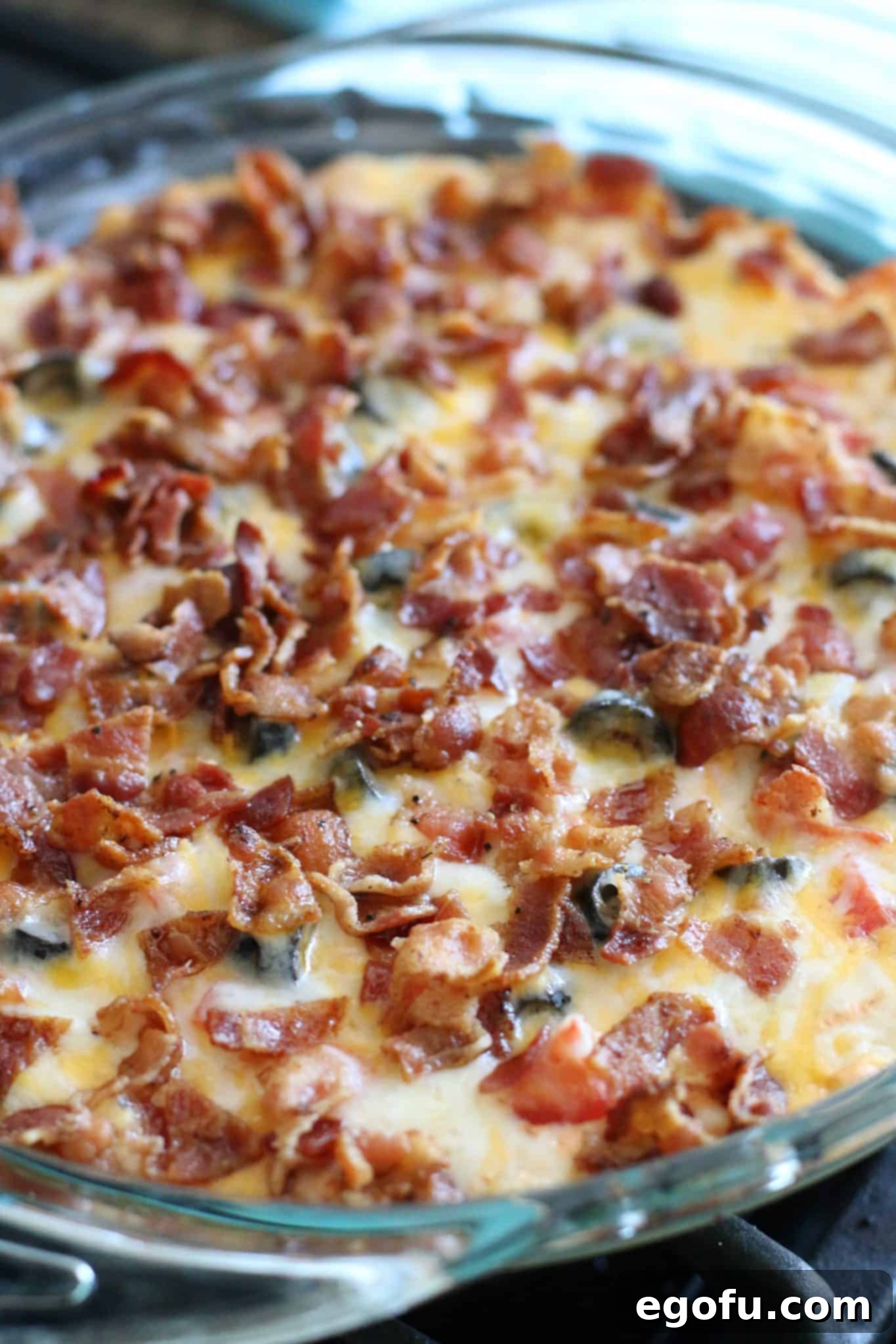Hot Cheesy Bacon Dip 9 Warm Bacon Cheddar Dip, fully cooked and bubbling in a pie dish, with perfectly melted cheese and crispy bacon.