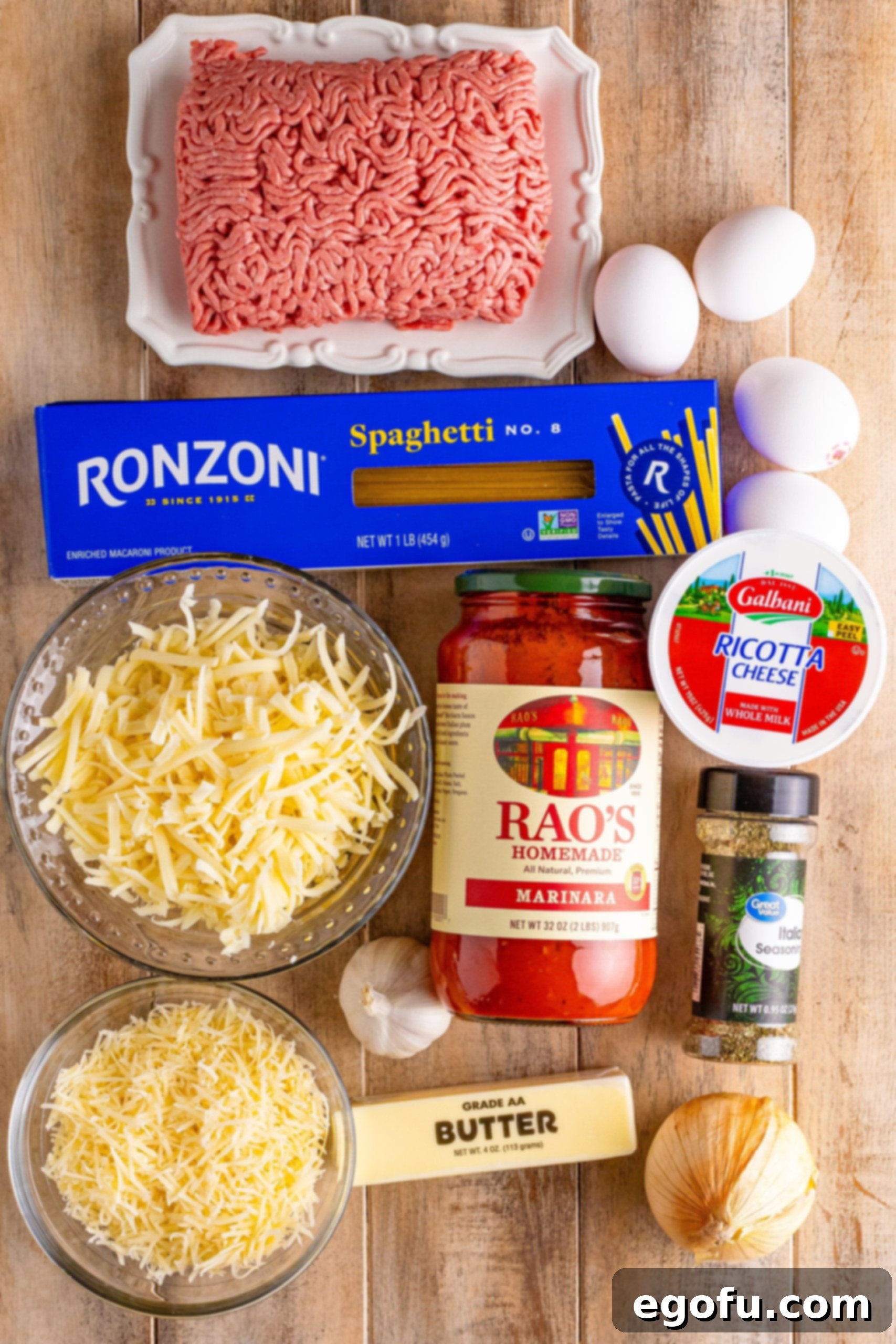 Ground beef, marinara sauce, spaghetti, butter, onion, eggs, shredded cheese, salt, oregano, and ricotta cheese.