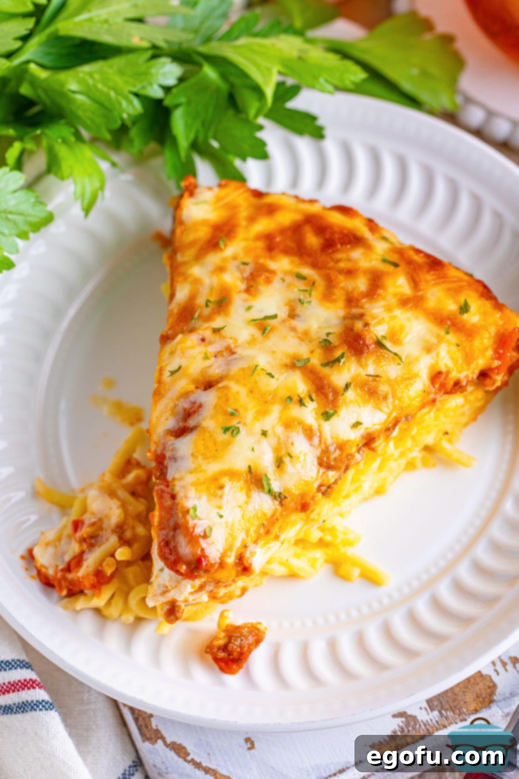 Looking down on some Spaghetti Pie on a plate.