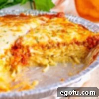 Closely looking at Spaghetti Pie on a pie plate.