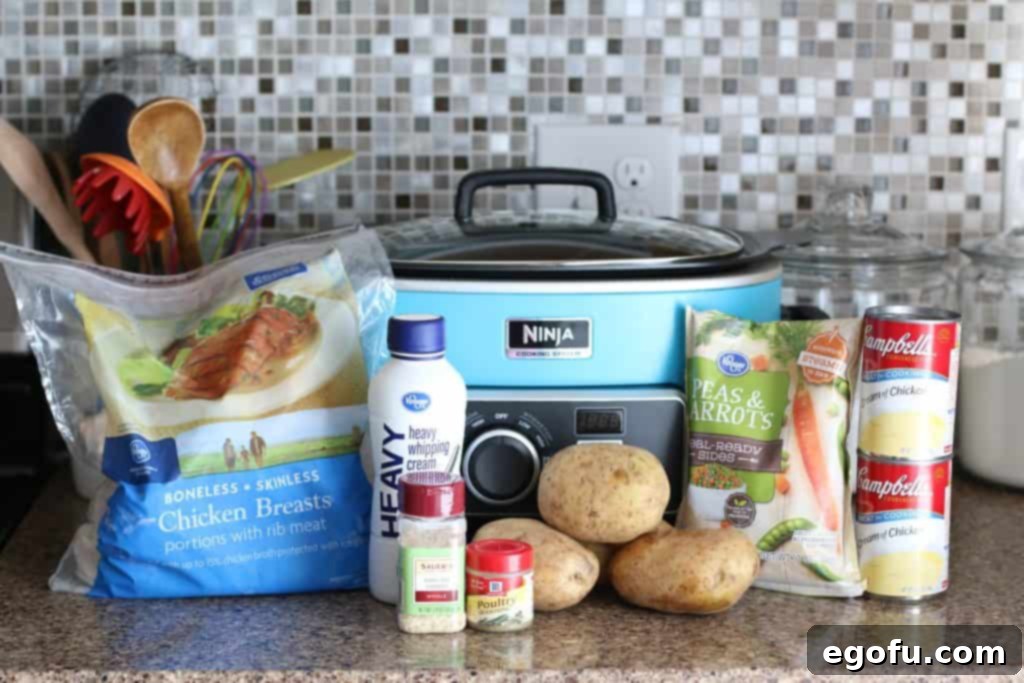 chicken breasts, heavy cream, cream of chicken, potatoes, peas and carrots, biscuits, onion