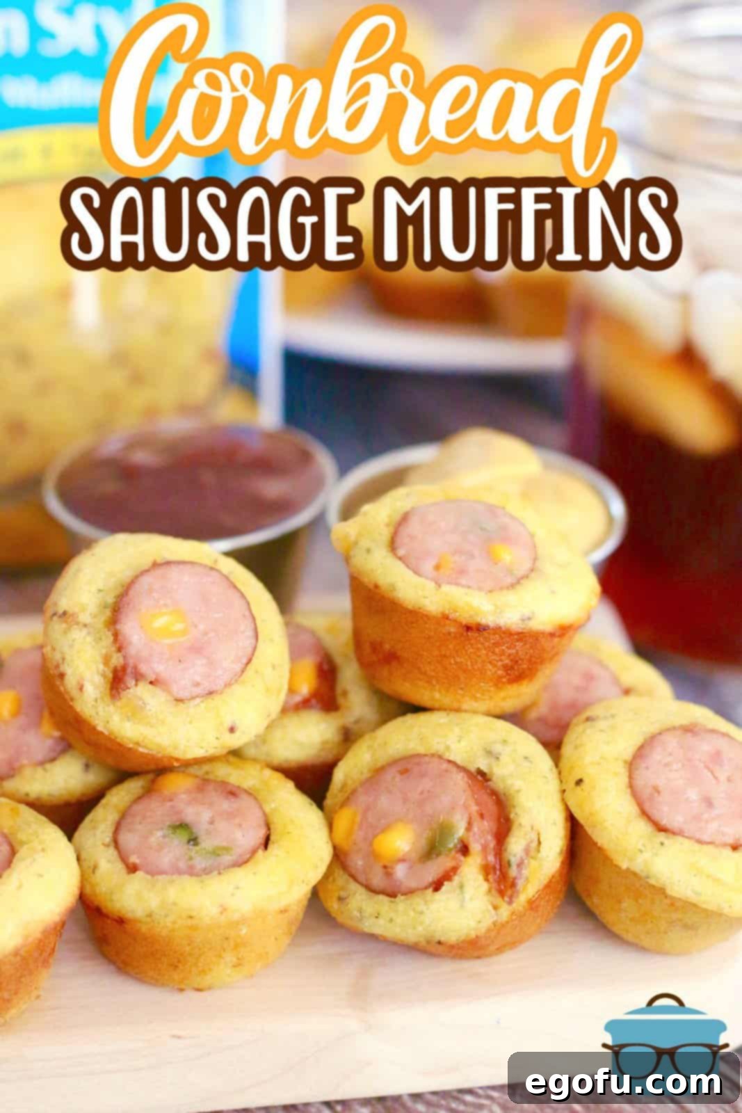 Close-up shot of golden cornbread sausage bites resting on a wooden cutting board, showcasing their inviting texture and delicious appearance.