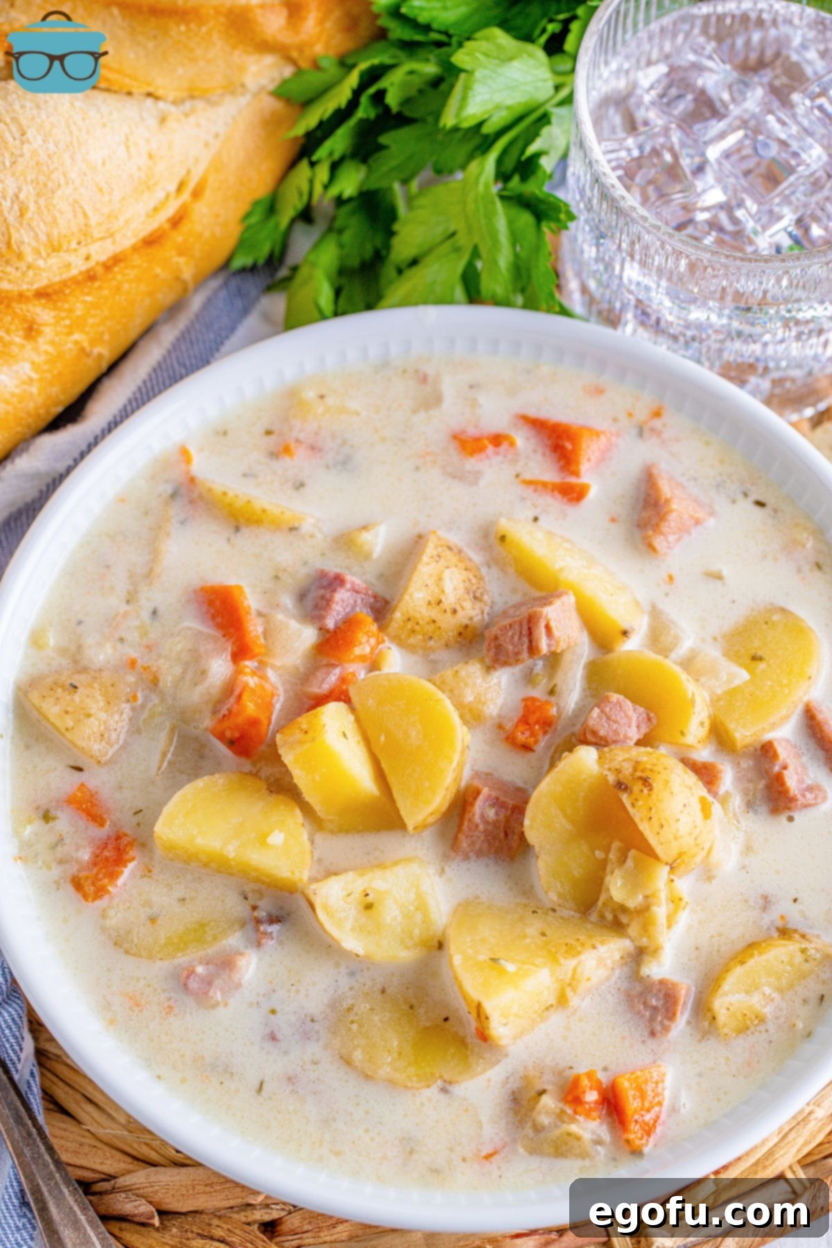 A large serving bowl of Ham and Potato Soup from the Crock Pot.