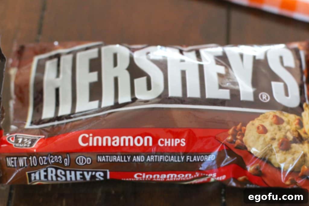 Harvest Moon Pumpkin Dream 17 A small bowl filled with Hershey's Cinnamon Chips, ready to be used as a garnish for the Magic Pumpkin Layer Cake.