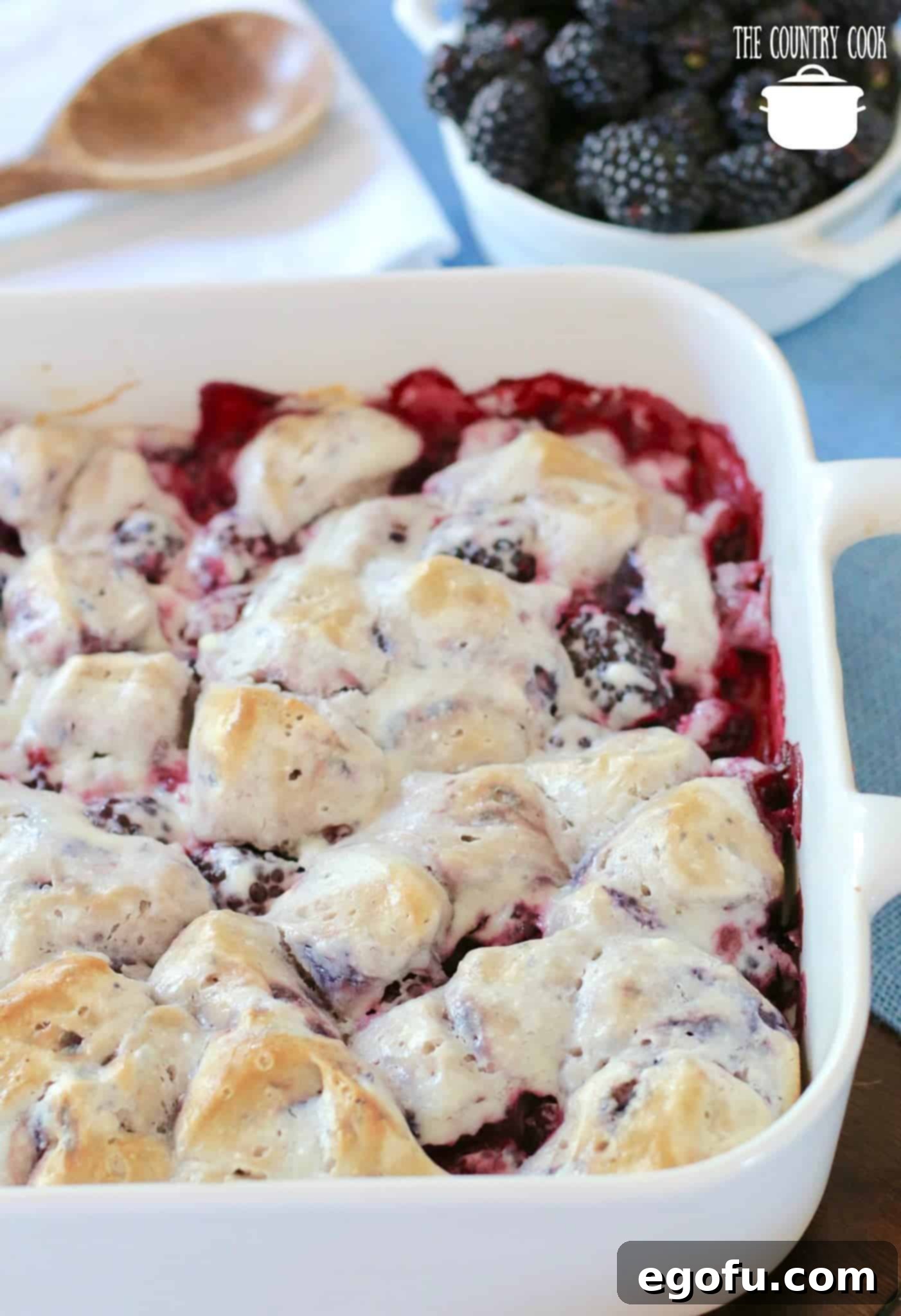 Blackberry Burst Bake 12 Easy Blackberry Bubble Up recipe with fresh blackberries shown baked in a white baking dish, golden brown and bubbly.