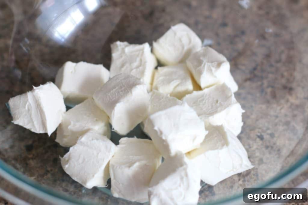 Blackberry Burst Bake 5 Cubed cream cheese in a bowl, ready for softening.