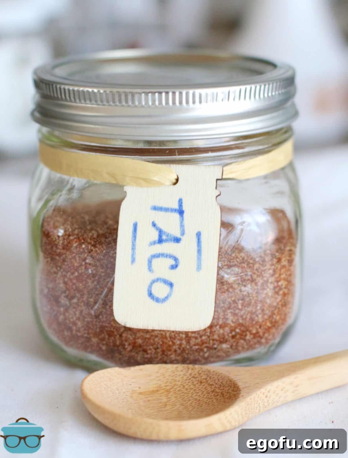 Easy Homemade Taco Seasoning 2 jar of taco seasoning with a tag on the front that has "Taco" written on it.
