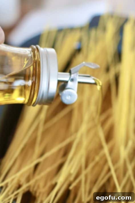 Effortless Slow Cooker Spaghetti and Meatballs 18 sizzling olive oil on top of spaghetti noodles