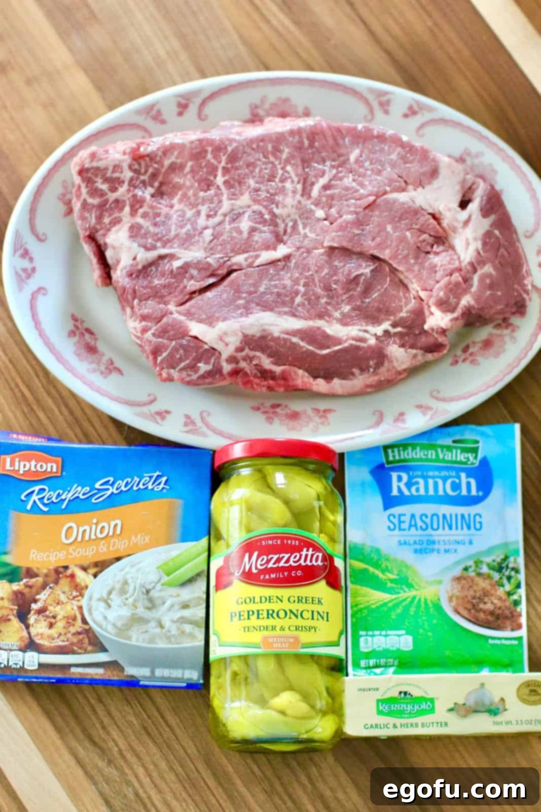 Chuck roast, ranch dressing mix, onion soup mix, salted butter and pepperoncini peppers.