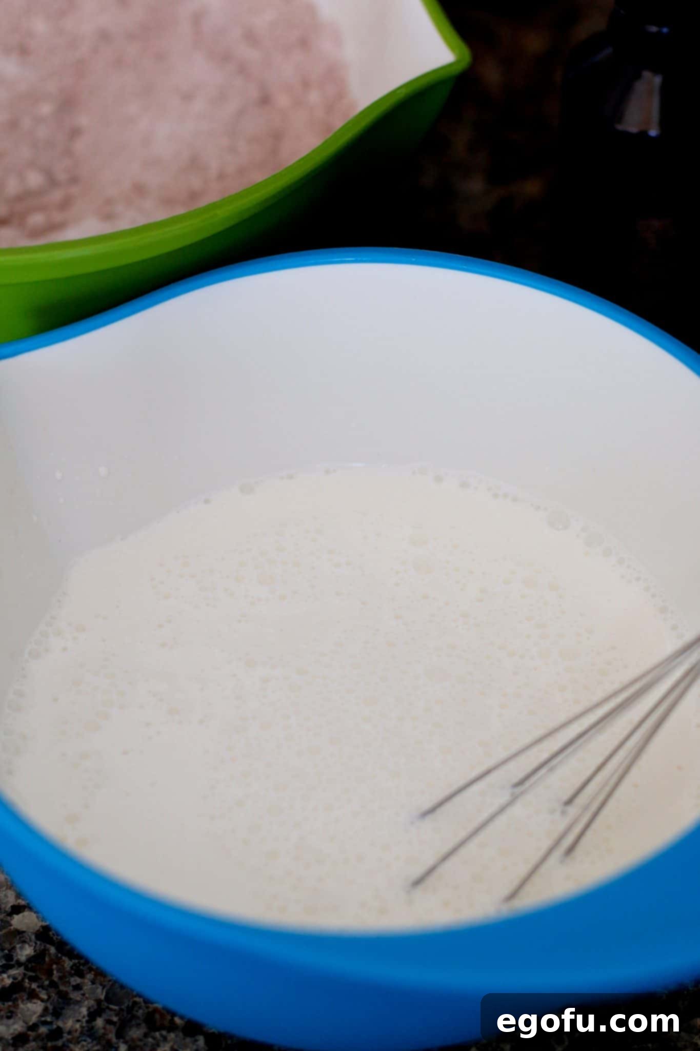 water and mayonnaise whisked together in a bowl.