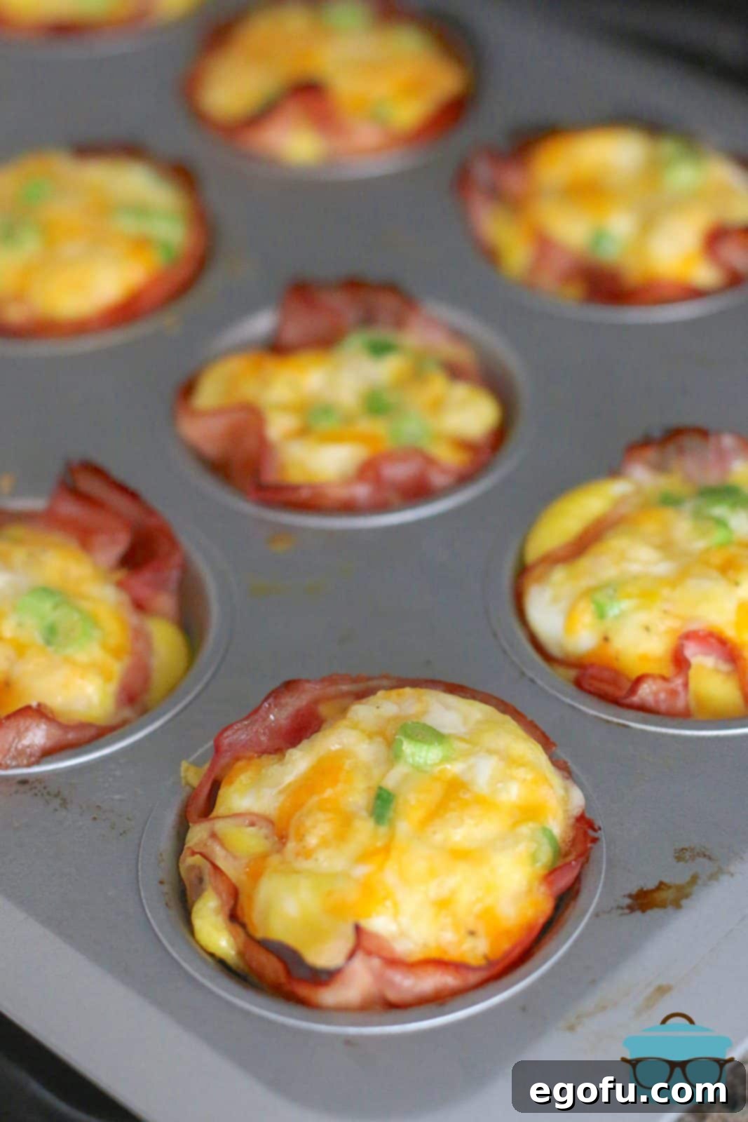 Breakfast Ham and Egg Nests 2 ham and egg cups shown in a muffin tin.