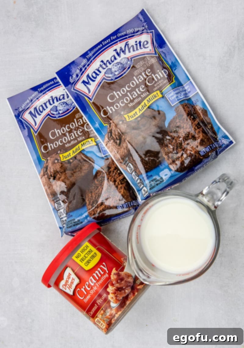 Three key ingredients for German Chocolate Muffins: Chocolate Chocolate Chip Muffin mix, milk, and a tub of coconut pecan frosting.