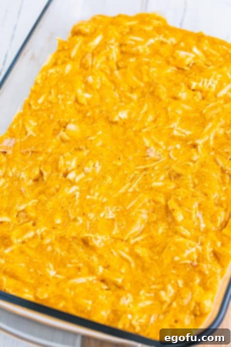 The chicken and sauce layer over top of the Bisquick batter layer in a baking dish.