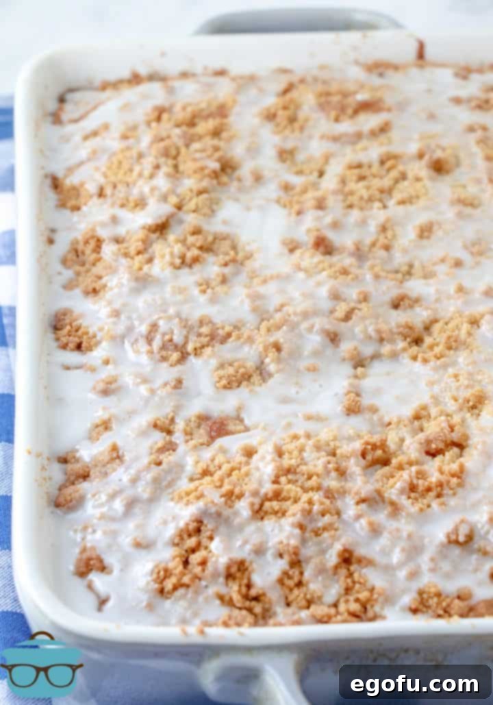 Fully baked Banana Bread Crumb Cake with a golden-brown crumb topping, presented in a 9x13 baking dish, ready to be served.