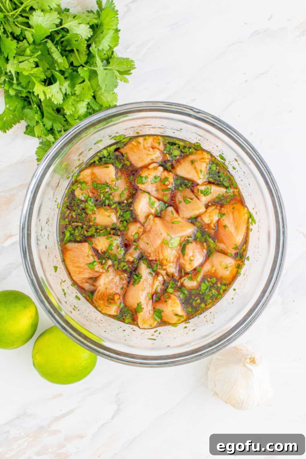 diced chicken breasts added to clear bowl.