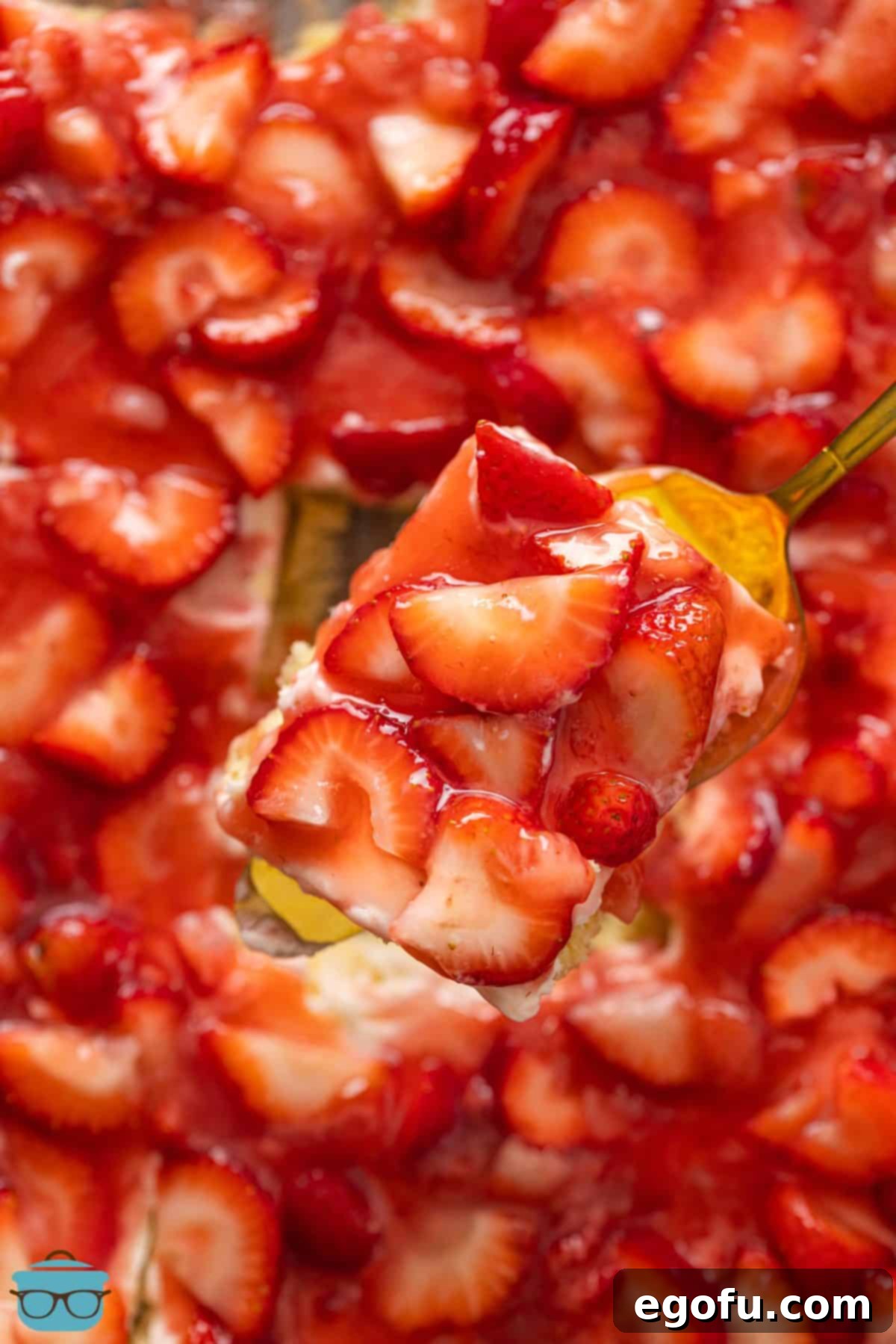 A Strawberries and Cream Bar being removed from the rest of the dessert dish, showing the distinct layers.