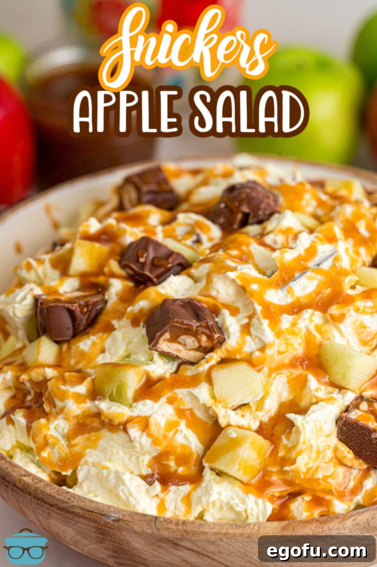 Creamy Snickers Apple Delight 3 A large brown serving bowl of Snickers Apple Salad.