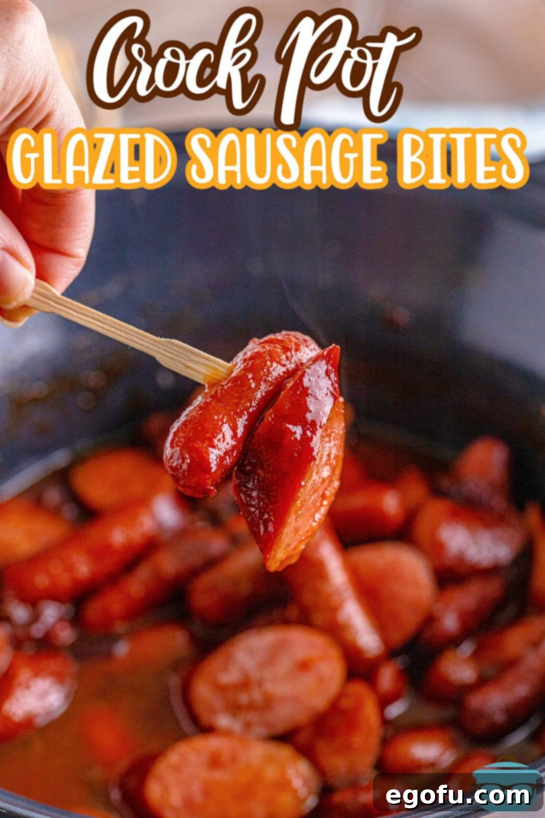 a small bamboo toothpick holding up a piece of kielbasa and a lit'l smokie.