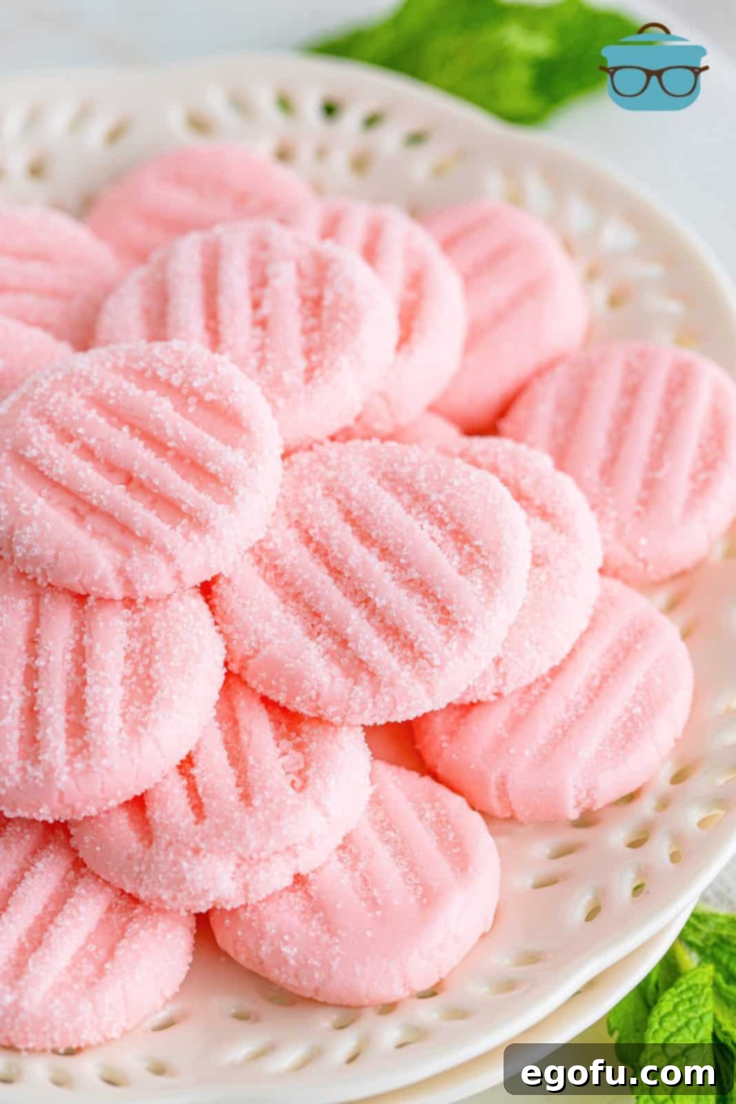 Refreshing Finales 2 Close up photo of homemade cream cheese after-dinner mints on a white plate, showcasing their smooth texture and vibrant color.