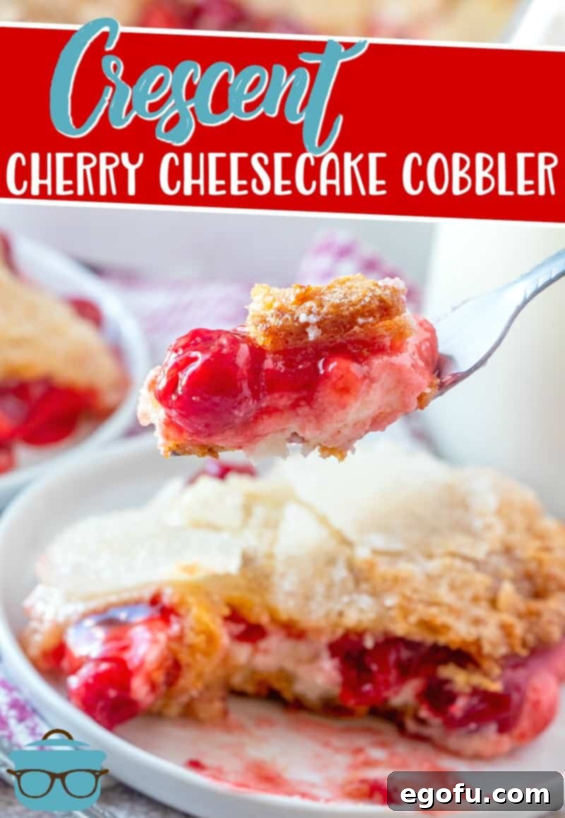 a fork holding up a piece of cherry cobbler over a plate. 