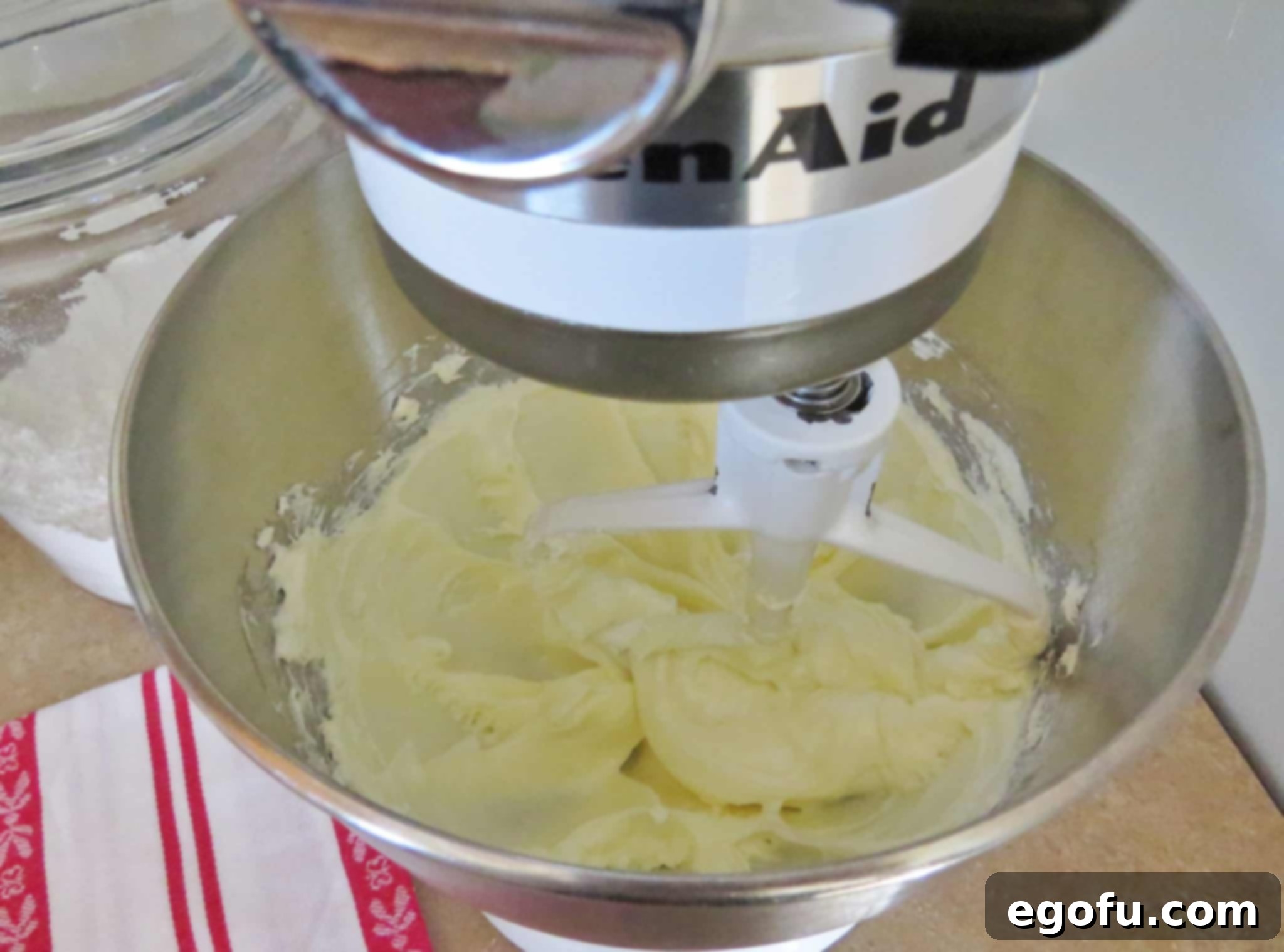 softened cream cheese and sugar mixed together in a Kitchen Aid stand mixer.