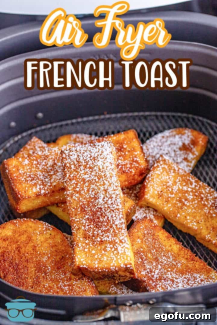 Crispy and golden brown French toast sticks neatly arranged inside the basket of an air fryer, ready to be served.