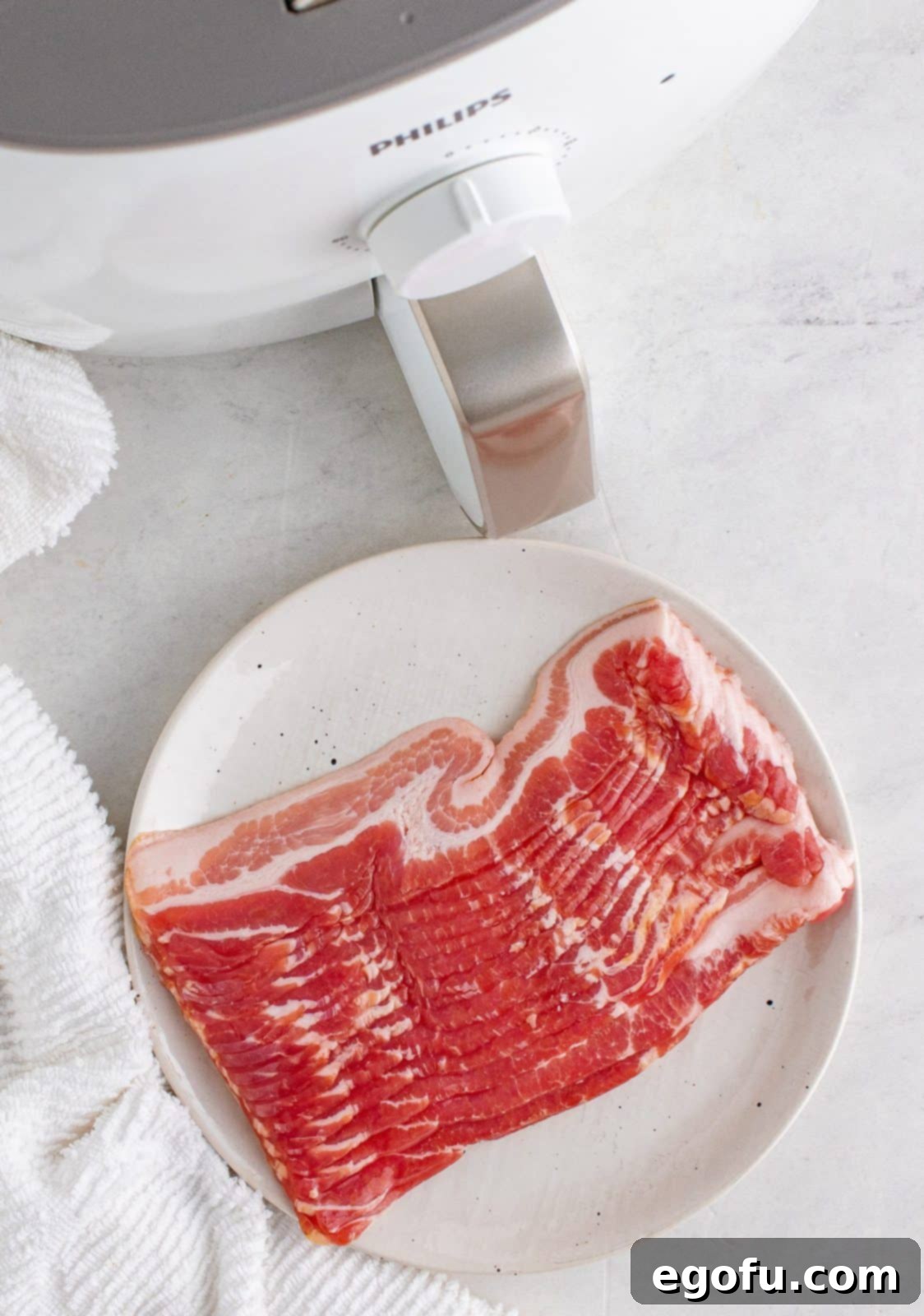 Crispy Air Fryer Bacon Spirals 4 Simple ingredients for Air Fryer Twisted Bacon: a package of center-cut bacon.