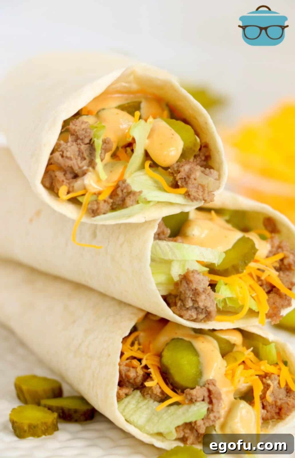 Three stacked Big Mac Wraps showing inside filling.