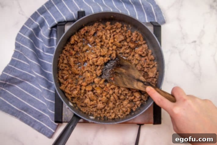 Puffy Pizza Bake 10 browning Italian sausage in a skillet.