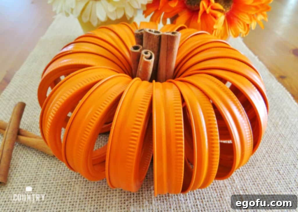 Autumn Jar Lid Pumpkins 2 spray painted mason jar lids ready for assembly