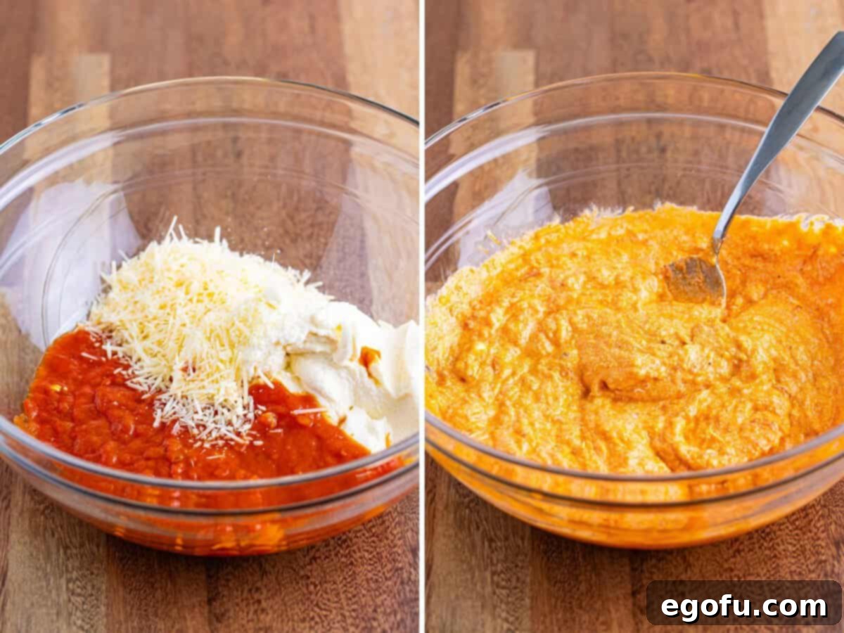 A mixing bowl holding a vibrant blend of marinara sauce, creamy ricotta cheese, and grated Parmesan cheese, perfectly combined and ready for the next step.