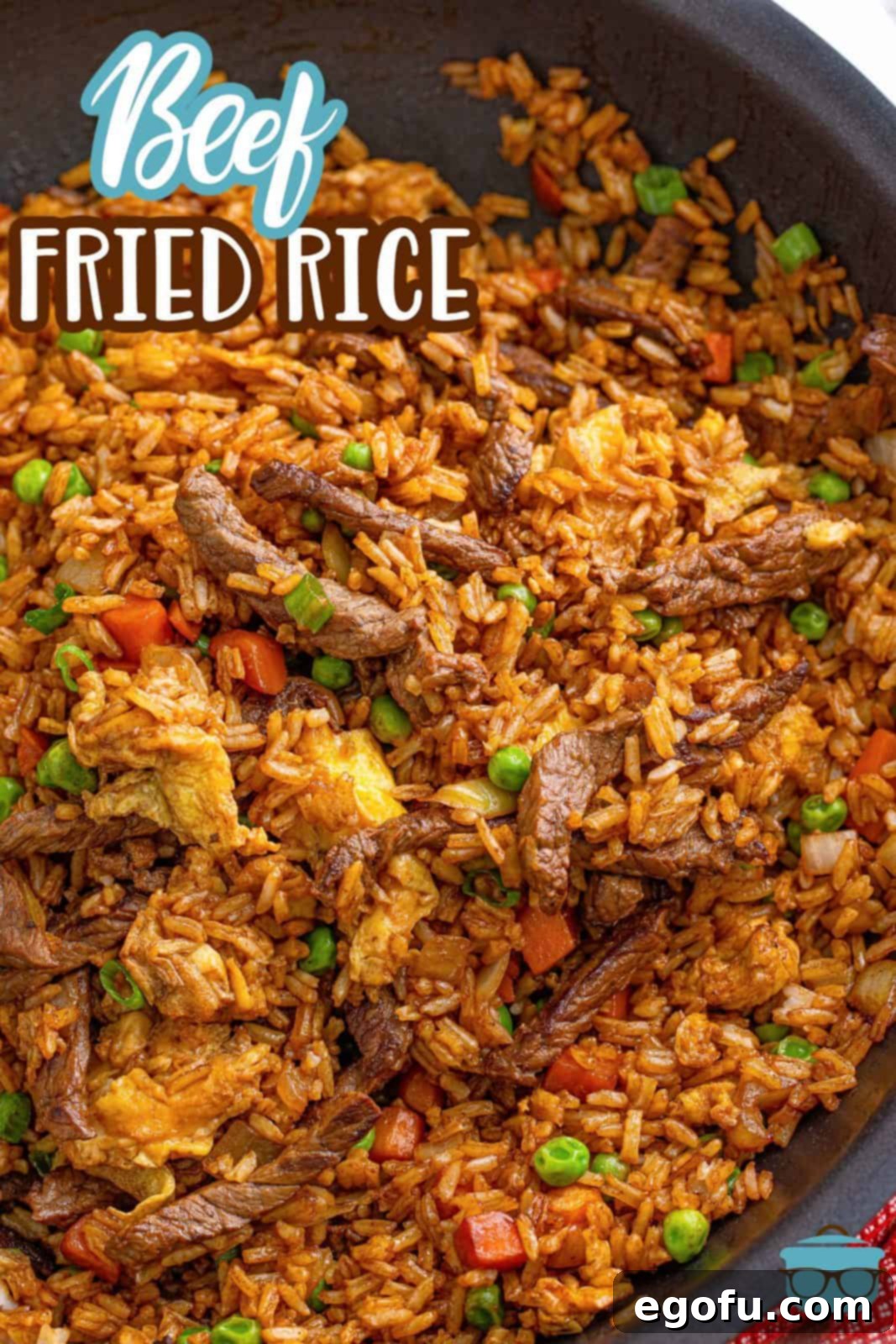 Sizzling Beef Fried Rice 3 Pinterest image of Beef Fried Rice close up in pan.