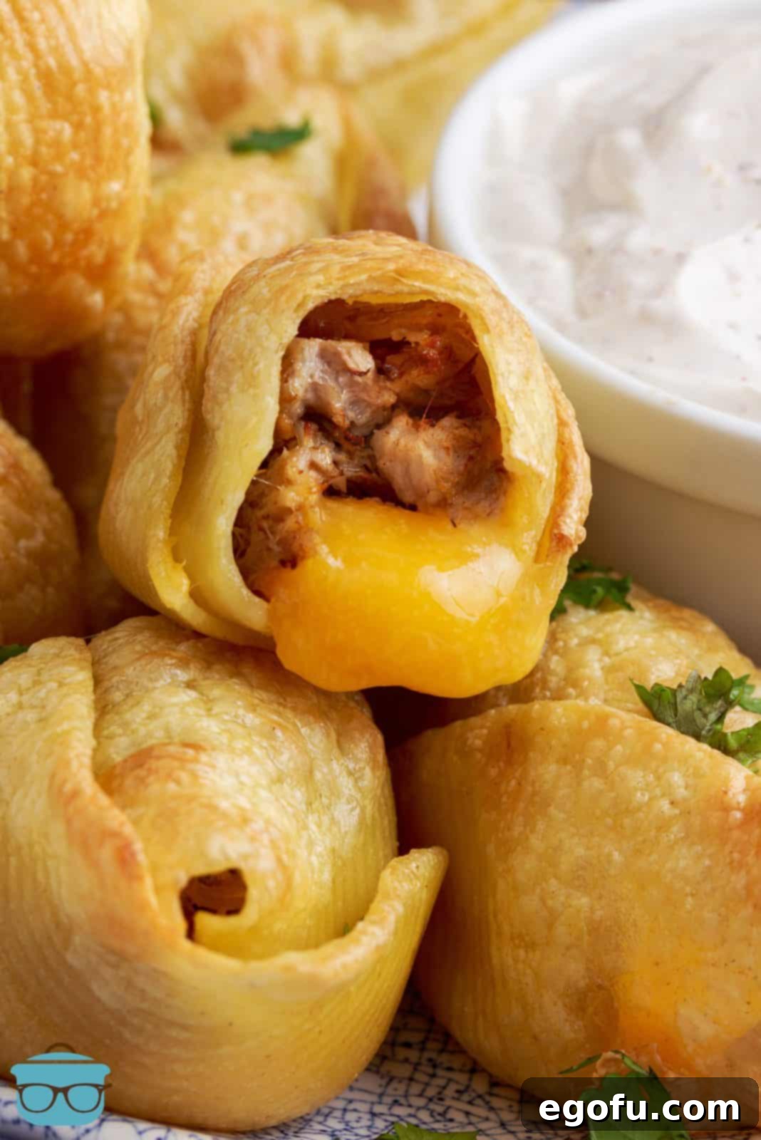 Crispy Air Fryer Taco Shells 11 Stacked Air Fryer Taco Stuffed Shells with one showing inside and cheese melting out.