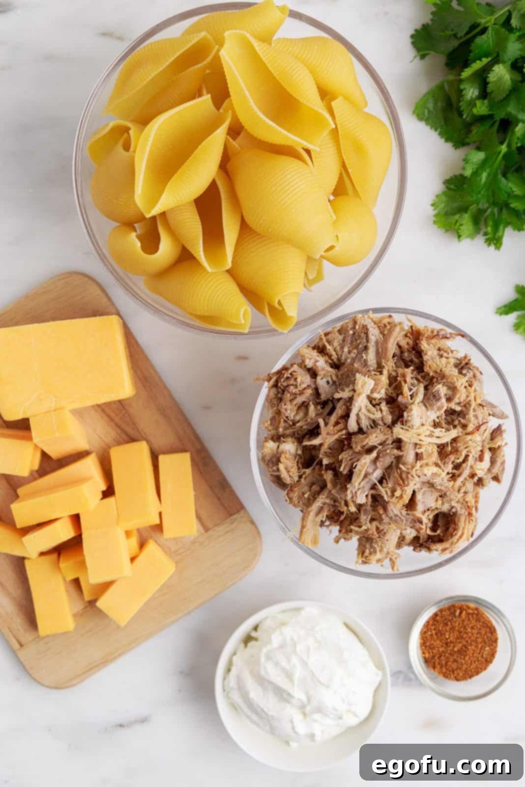 Crispy Air Fryer Taco Shells 4 Ingredients needed: jumbo pasta shells, carnitas, cheddar cheese, sour cream and taco seasoning.
