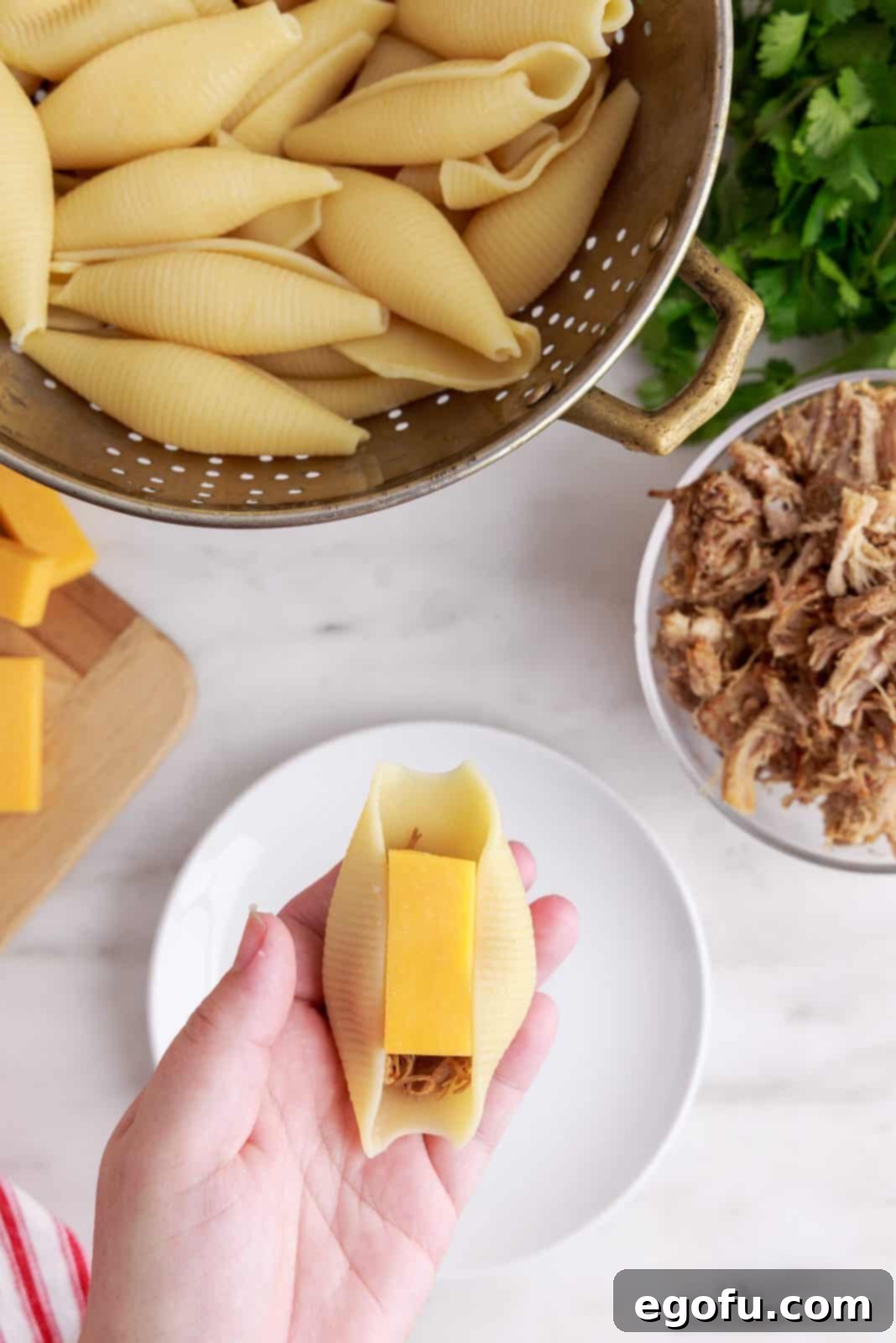 Crispy Air Fryer Taco Shells 5 Hand holding one shell with cheese and carnitas inside.
