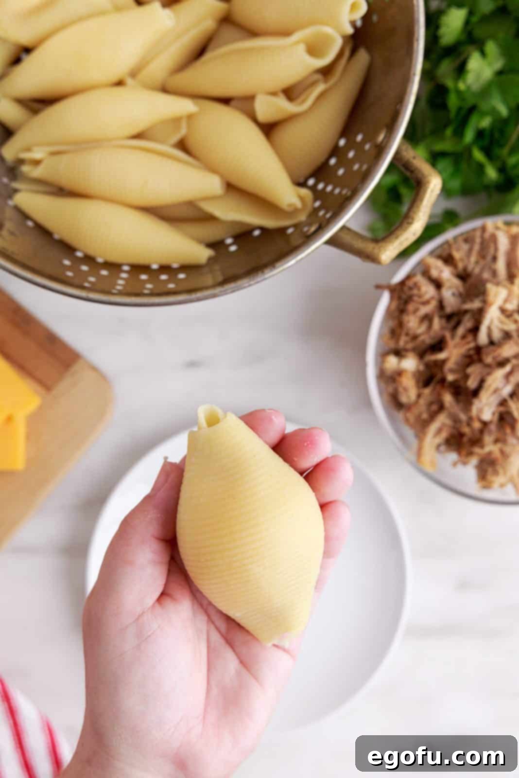 Crispy Air Fryer Taco Shells 6 Hand holding stuffed shell with another shell covering the top.