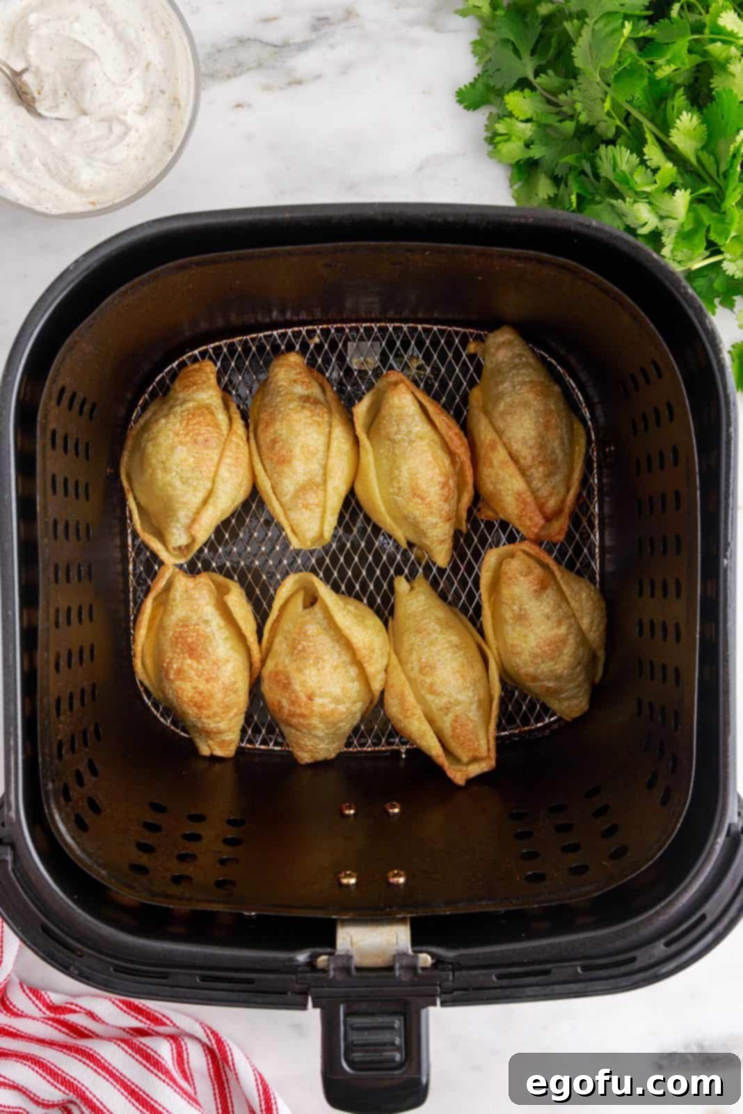 Crispy Air Fryer Taco Shells 9 Finished shells in air fryer showing golden brown shells.