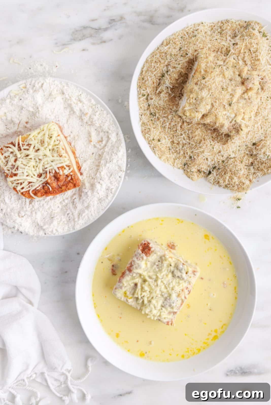 A step-by-step photographic demonstration of the precise dredging process for lasagna, showing each piece being coated in flour, then egg wash, then breadcrumbs.