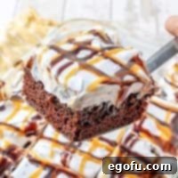 Snickers Poke Cake recipe from The Country Cook