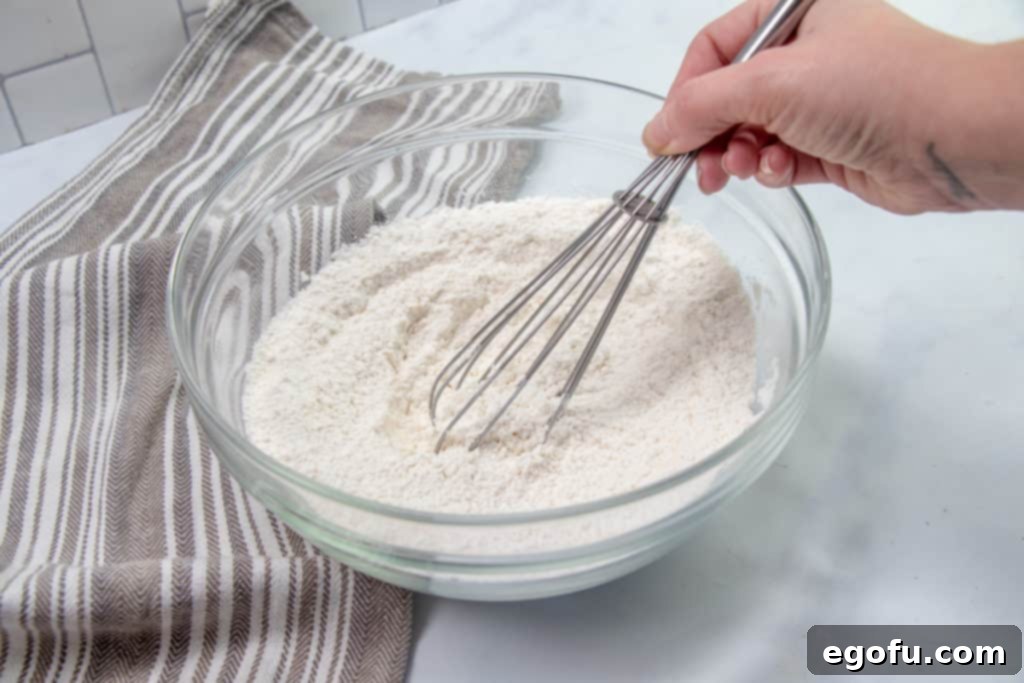 flour, sugar, baking powder and salt whisked together in a bowl.