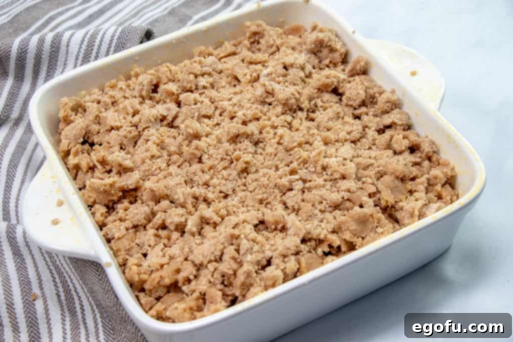 brown sugar crumbs sprinkled on top of cake batter.