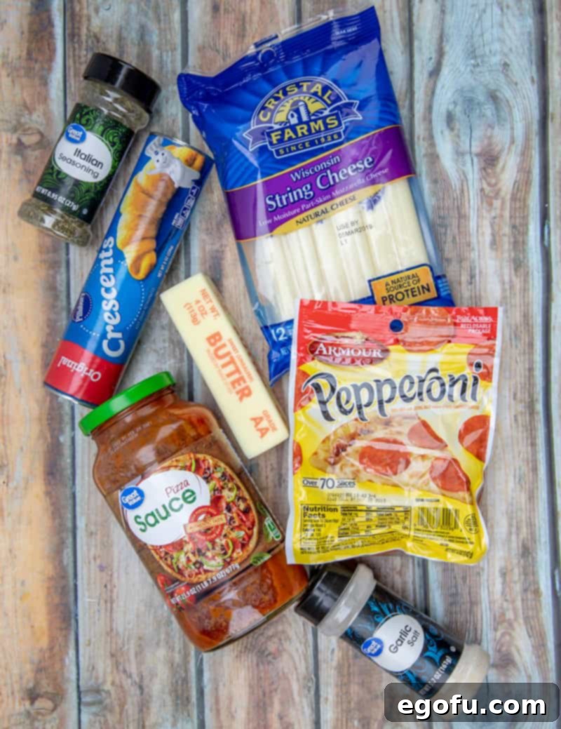 refrigerated crescent rolls, pepperoni, mozzarella cheese sticks, salted butter, Italian seasoning, garlic salt, pizza sauce.