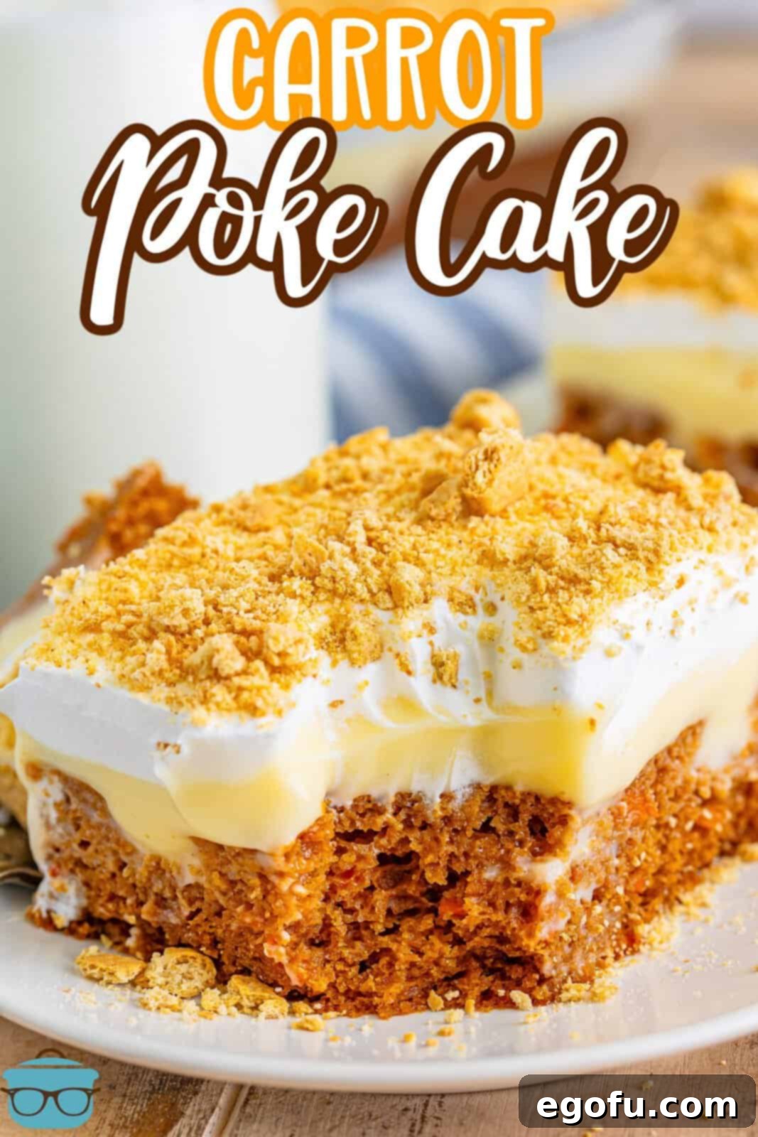 Super Moist Carrot Poke Cake 3 A white dessert plate with a serving of Carrot Pudding poke Cake.