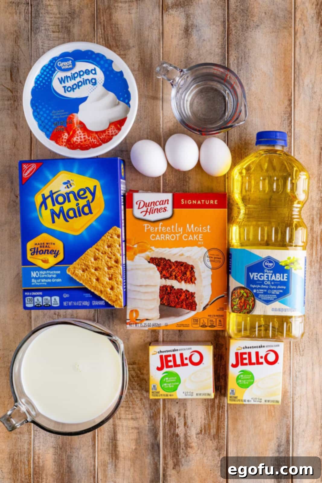 Super Moist Carrot Poke Cake 4 Carrot cake mix, oil, water, eggs, cheesecake pudding mix, milk, whipped topping, and graham crackers.