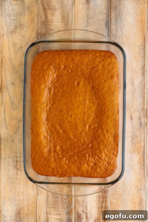 Super Moist Carrot Poke Cake 11 A baked Carrot Cake in a glass baking dish.