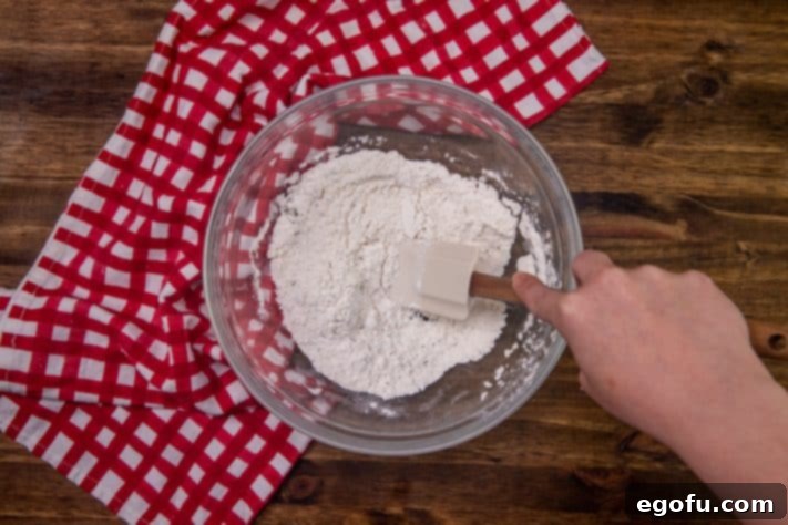 Cheesy Pepperoni Poppers 13 flour mixture in bowl.